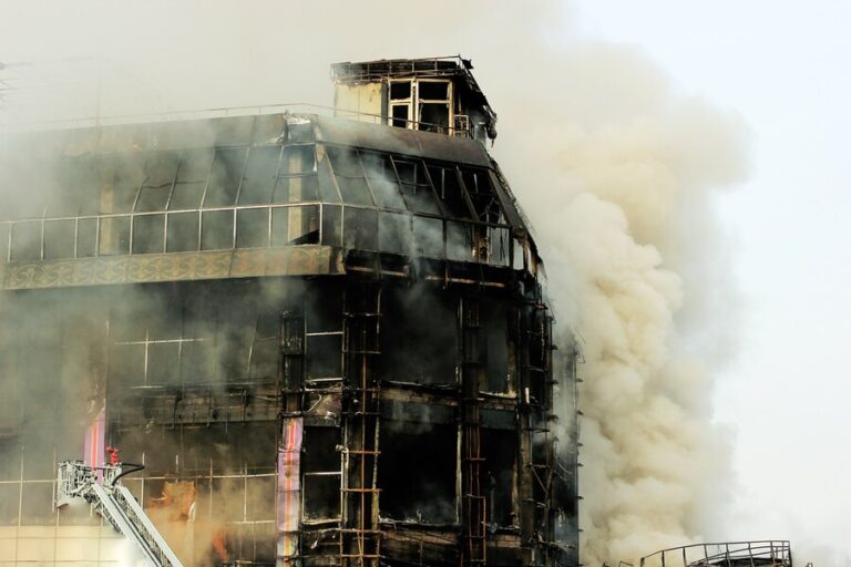 burning-shopping-center-mall-with-smoke_114579-1362