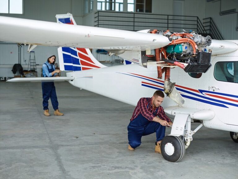 engineers-working-with-airplane_1098-12550