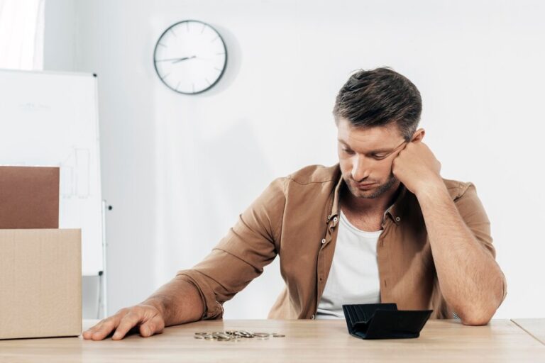 medium-shot-tired-man-with-coins_23-2148773988