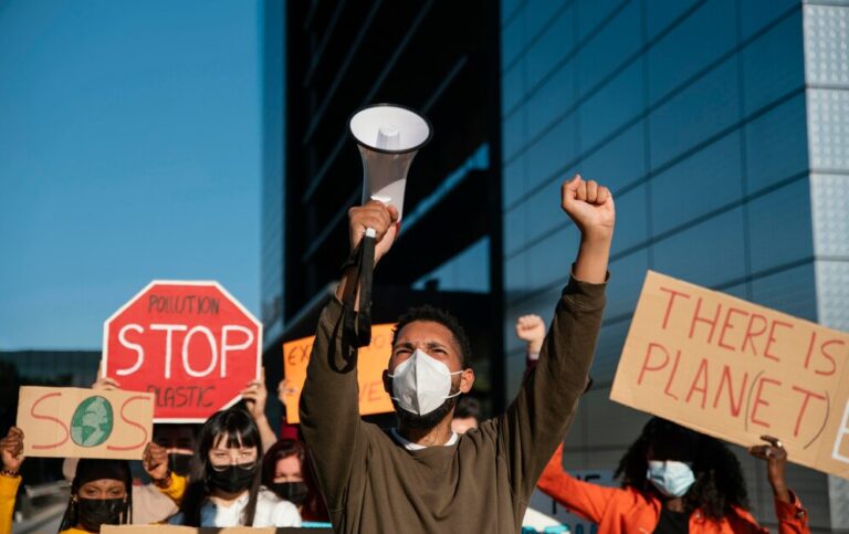 people-wearing-masks-environmental-protest_23-2148970954